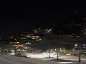 Neon Night Skiing and Snowboarding